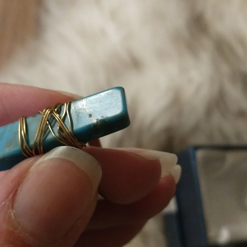 Super cute gold wire wrapped faux turquoise adjustable ring.